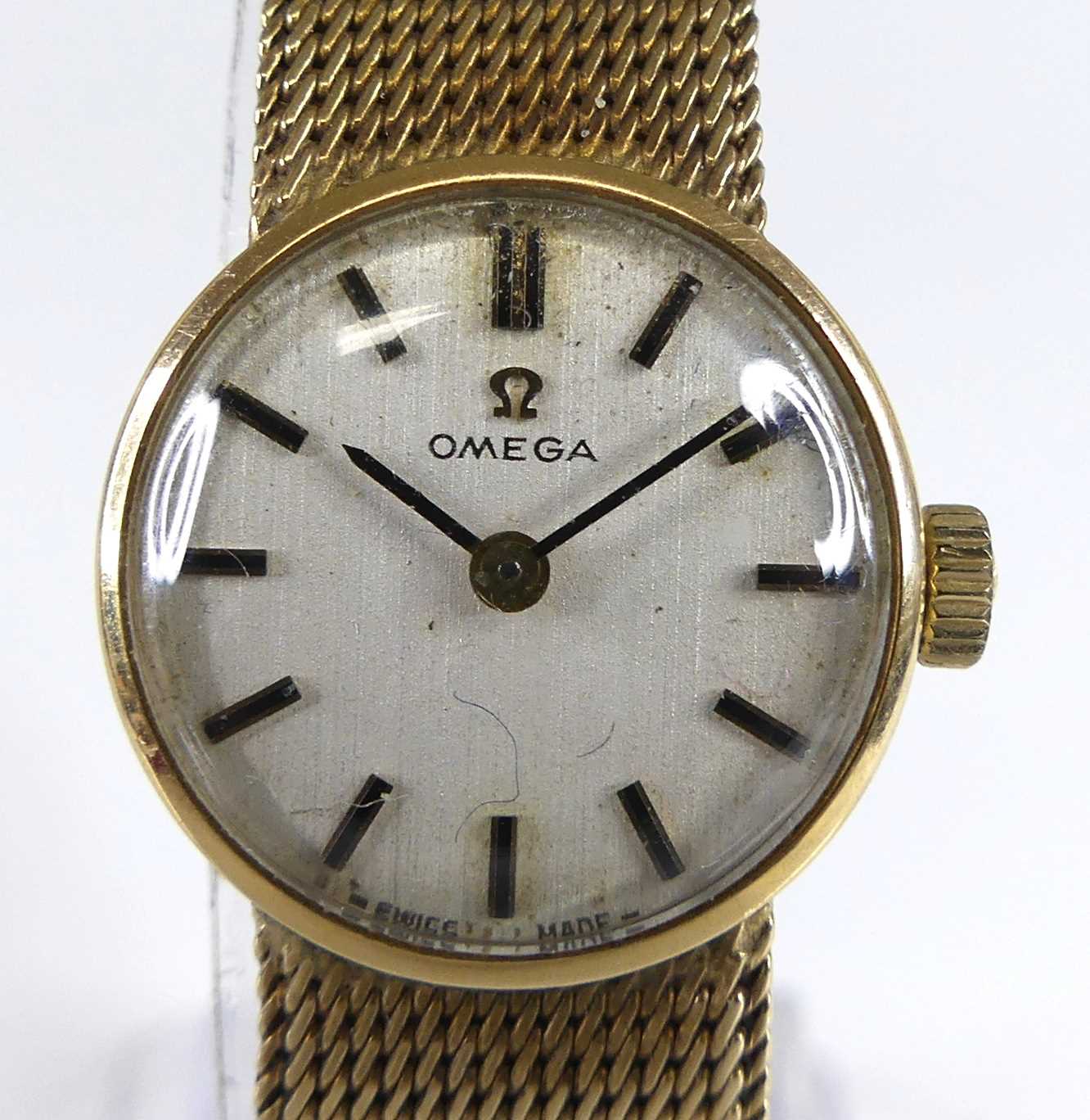Lot 2639 - An Omega lady's 9ct gold cased bracelet watch,...