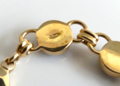 Lot 2599 - A 9ct gold cabochon garnet set bracelet,...