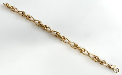 Lot 2602 - A modern heavy 9ct gold knot link bracelet,...