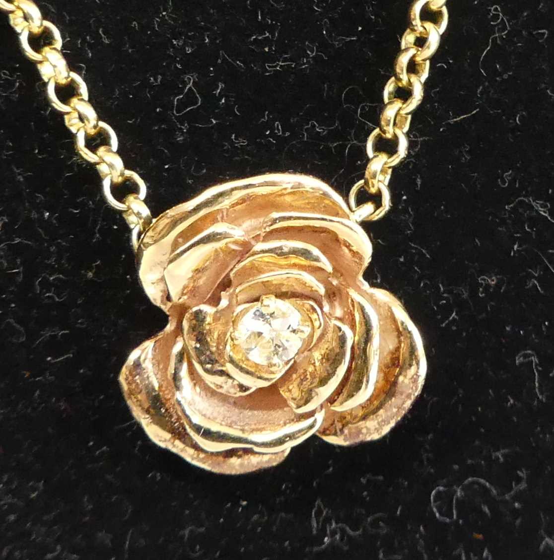 Lot 2682 - A 9ct gold diamond set pendant, arranged as a...
