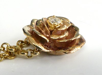 Lot 2682 - A 9ct gold diamond set pendant, arranged as a...