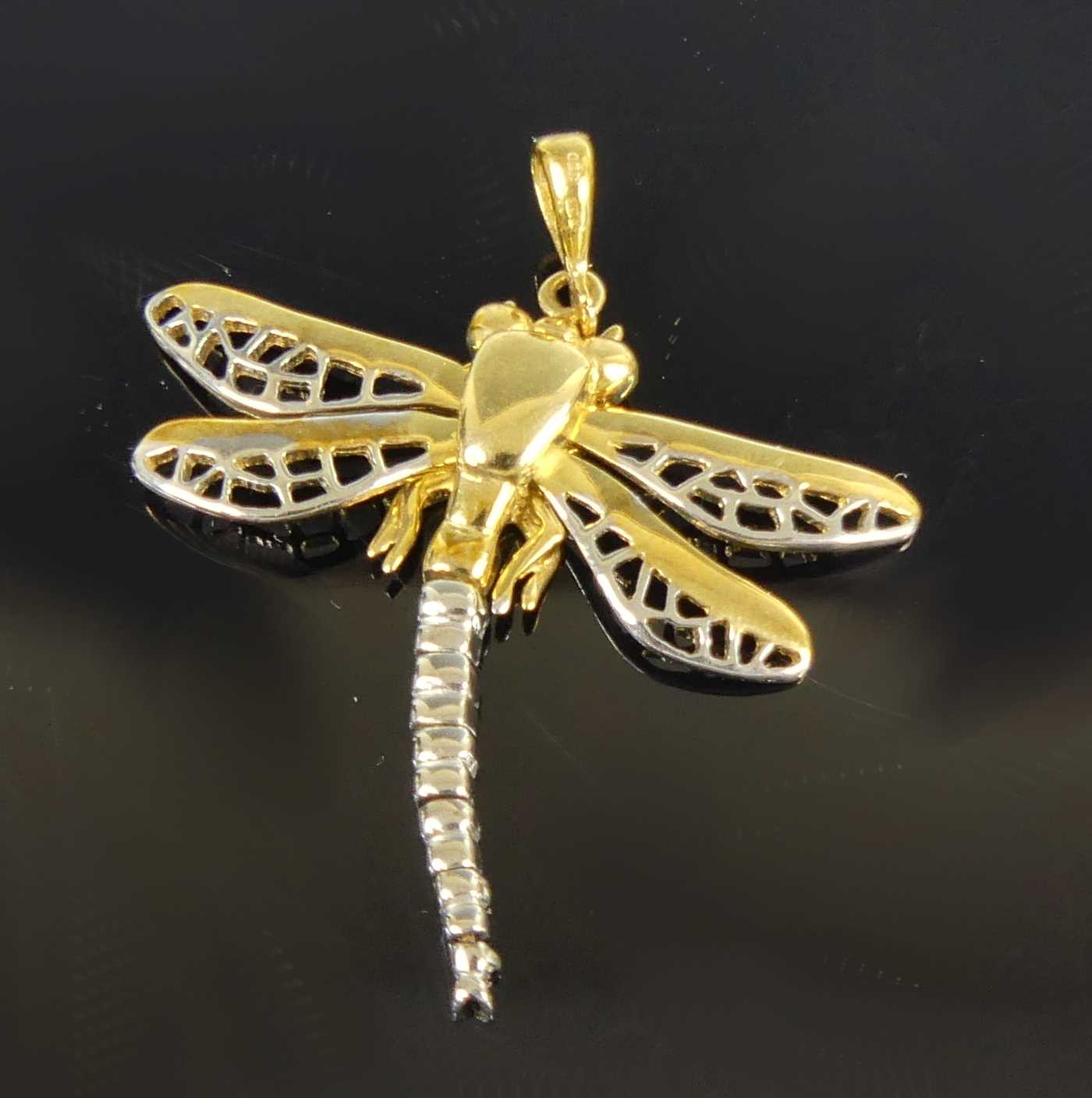Lot 2613 - A contemporary 9ct yellow and white gold...