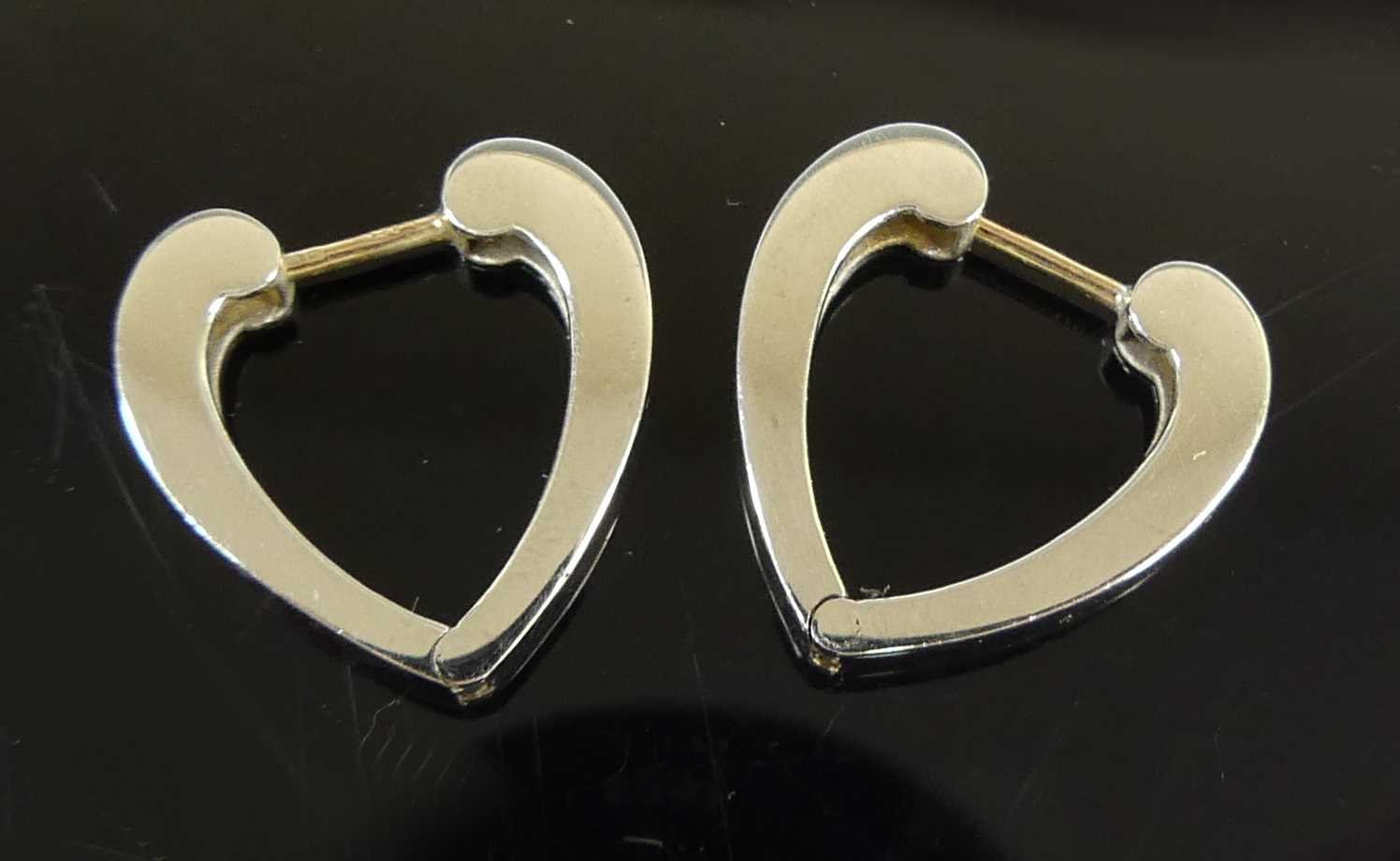 Lot 2614 - A pair of contemporary 9ct white gold earrings,...
