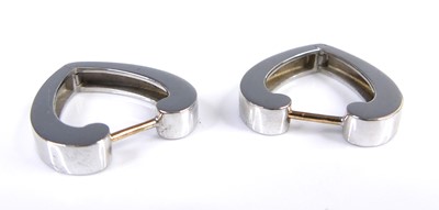 Lot 2614 - A pair of contemporary 9ct white gold earrings,...
