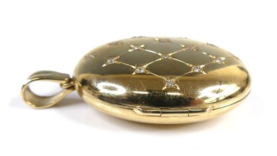 Lot 2615 - A contemporary 9ct gold diamond set oval...
