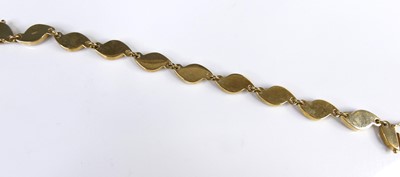 Lot 2617 - A contemporary 9ct gold and polished black...