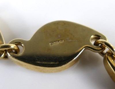 Lot 2617 - A contemporary 9ct gold and polished black...