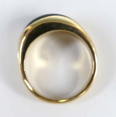 Lot 2618 - A contemporary 9ct gold and polished black...