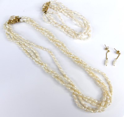 Lot 2628 - A contemporary rice pearl choker, arranged as...