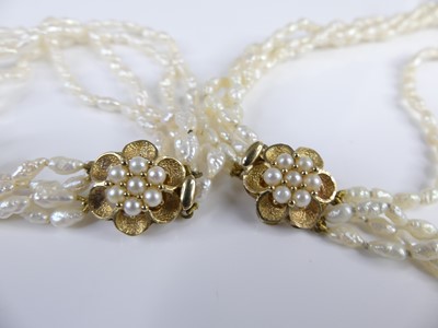 Lot 2628 - A contemporary rice pearl choker, arranged as...