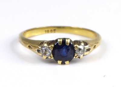 Lot 2604 - An 18ct gold sapphire and diamond three-stone...