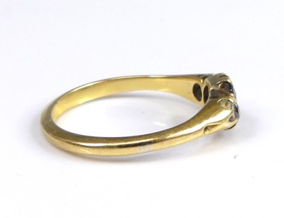 Lot 2604 - An 18ct gold sapphire and diamond three-stone...