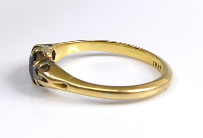 Lot 2604 - An 18ct gold sapphire and diamond three-stone...