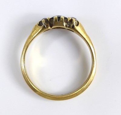 Lot 2604 - An 18ct gold sapphire and diamond three-stone...