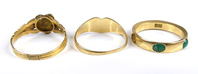 Lot 2608 - An 18ct gold and turquoise set band ring (one...