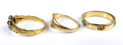 Lot 2608 - An 18ct gold and turquoise set band ring (one...