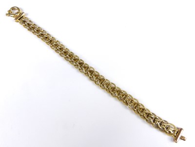 Lot 2611 - A 9ct gold spiga link bracelet, with ring...