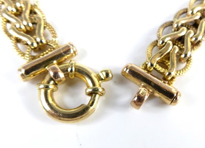 Lot 2611 - A 9ct gold spiga link bracelet, with ring...