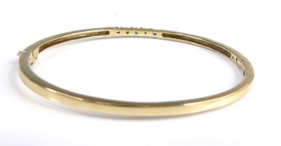 Lot 2651 - A 9ct gold sapphire and diamond set hinge...
