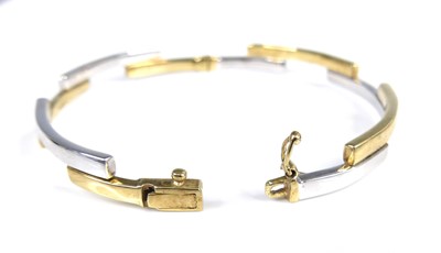 Lot 2612 - A contemporary 9ct yellow and white gold hinge...