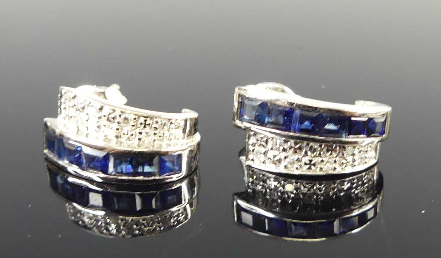 Lot 2684 - A pair of 14ct white gold sapphire and diamond...