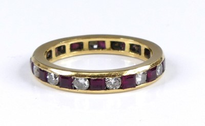 Lot 2675 - A yellow metal ruby and diamond eternity ring...