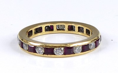 Lot 2675 - A yellow metal ruby and diamond eternity ring...