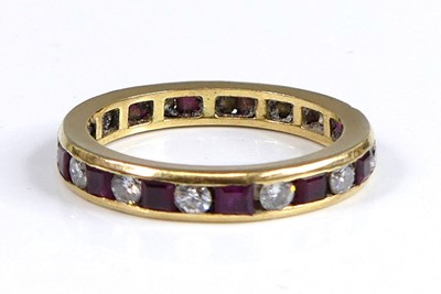 Lot 2675 - A yellow metal ruby and diamond eternity ring...
