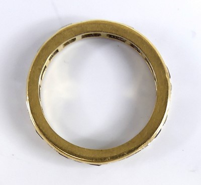 Lot 2675 - A yellow metal ruby and diamond eternity ring...