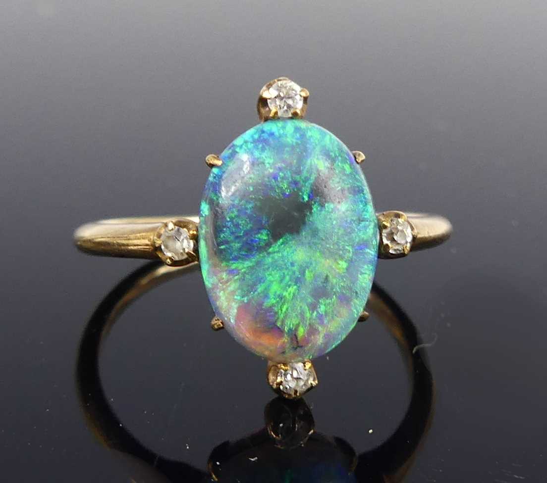 Lot 2676 - A rose metal opal and diamond dress ring, the...