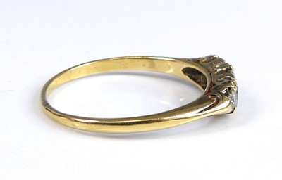 Lot 2687 - A yellow metal diamond 3 stone ring featuring...