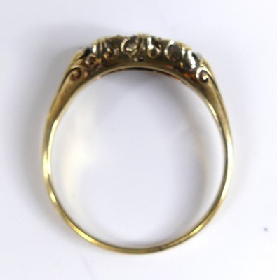 Lot 2687 - A yellow metal diamond 3 stone ring featuring...