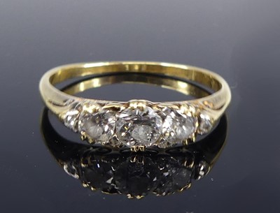 Lot 2687 - A yellow metal diamond 3 stone ring featuring...