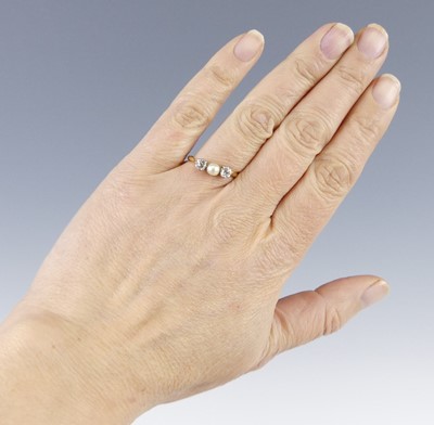 Lot 2688 - A yellow and white metal pearl and diamond 3...