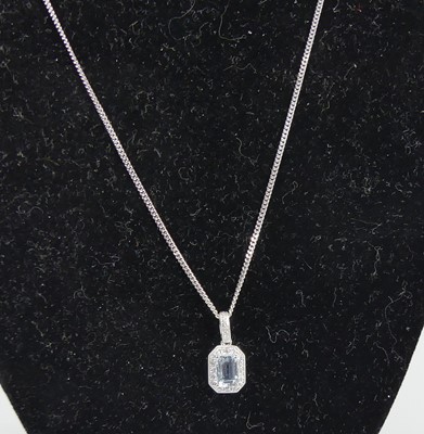 Lot 2689 - A 9ct white gold aquamarine and diamond...