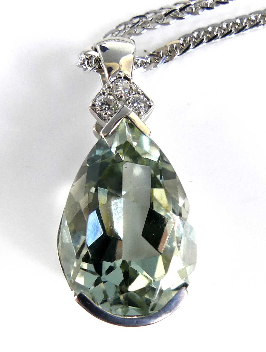 Lot 2690 - A 9ct white gold prasiolite and diamond...