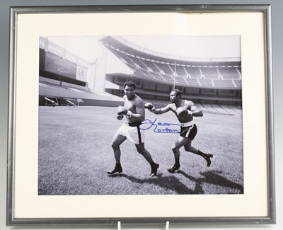 Lot 848 - Muhammad Ali and Ken Norton, a black and white...