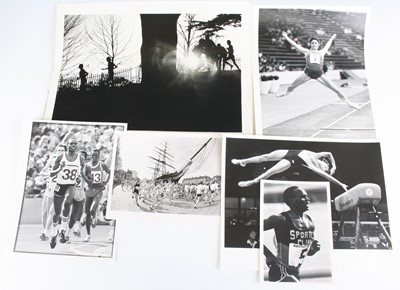 Lot 845 - A collection of sport related photographs to...