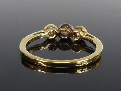 Lot 2560 - An 18ct gold diamond three-stone ring,...