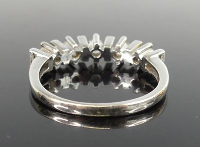 Lot 2518 - An 18ct white gold diamond half eternity ring...