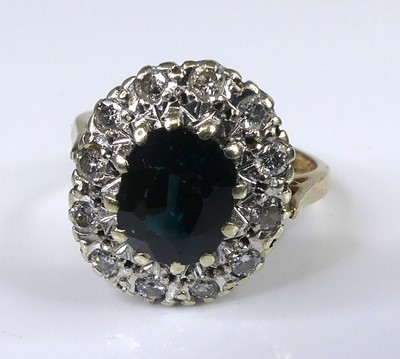 Lot 2539 - A 9ct yellow and white gold, sapphire and...