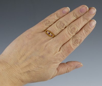 Lot 2555 - An Edwardian 18ct yellow gold ruby and diamond...