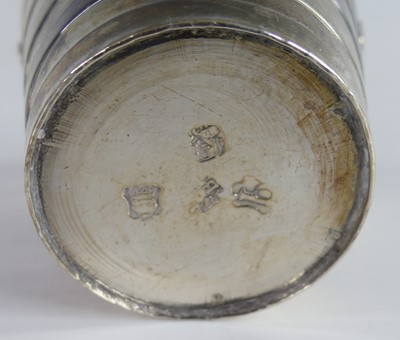 Lot 2074 - A George II silver gilt swing-handled table...