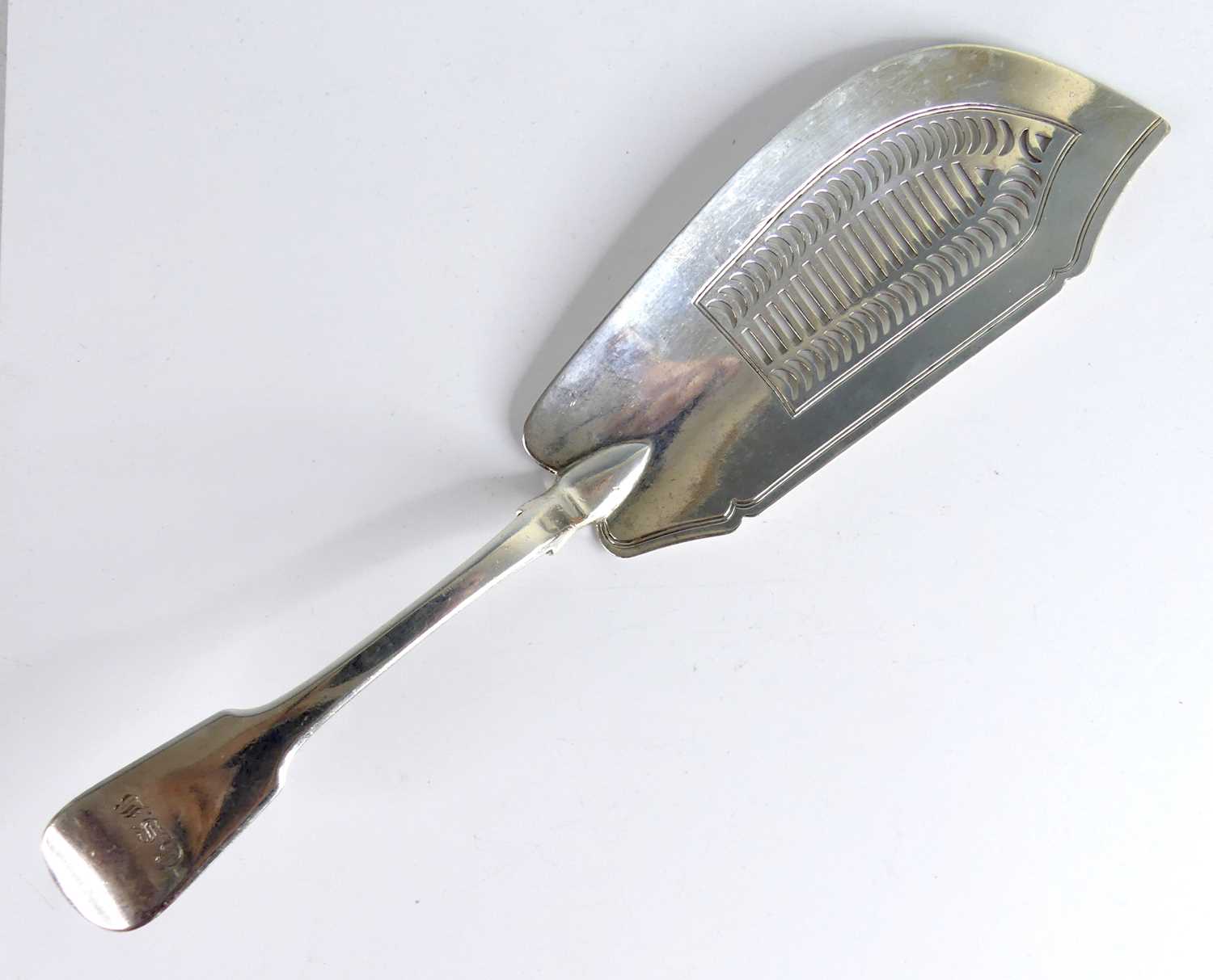 Lot 2101 - A George IV silver fish slice, in the Fiddle...