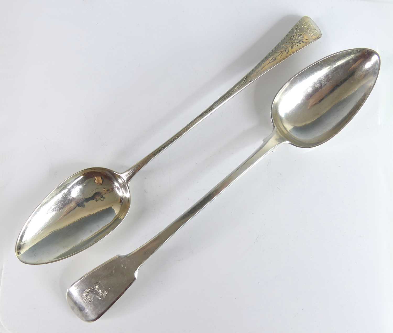 Lot 2086 - Two Georgian silver serving spoons, one in the...