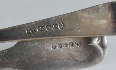Lot 2086 - Two Georgian silver serving spoons, one in the...