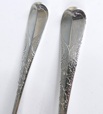 Lot 2065 - A pair of George II silver berry spoons,...