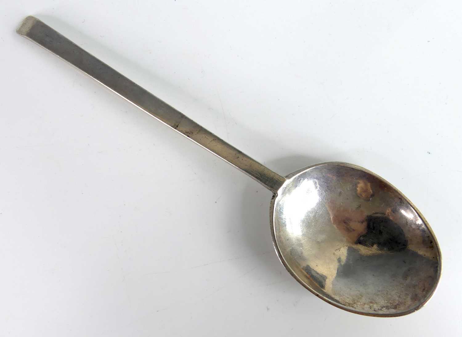 Lot 2063 - A white metal 'Puritan' spoon, of typical flat...