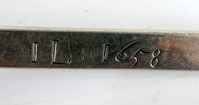Lot 2063 - A white metal 'Puritan' spoon, of typical flat...
