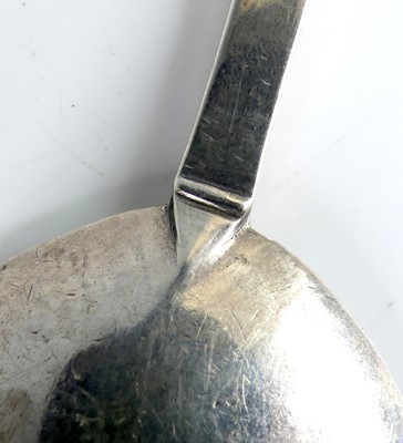Lot 2063 - A white metal 'Puritan' spoon, of typical flat...